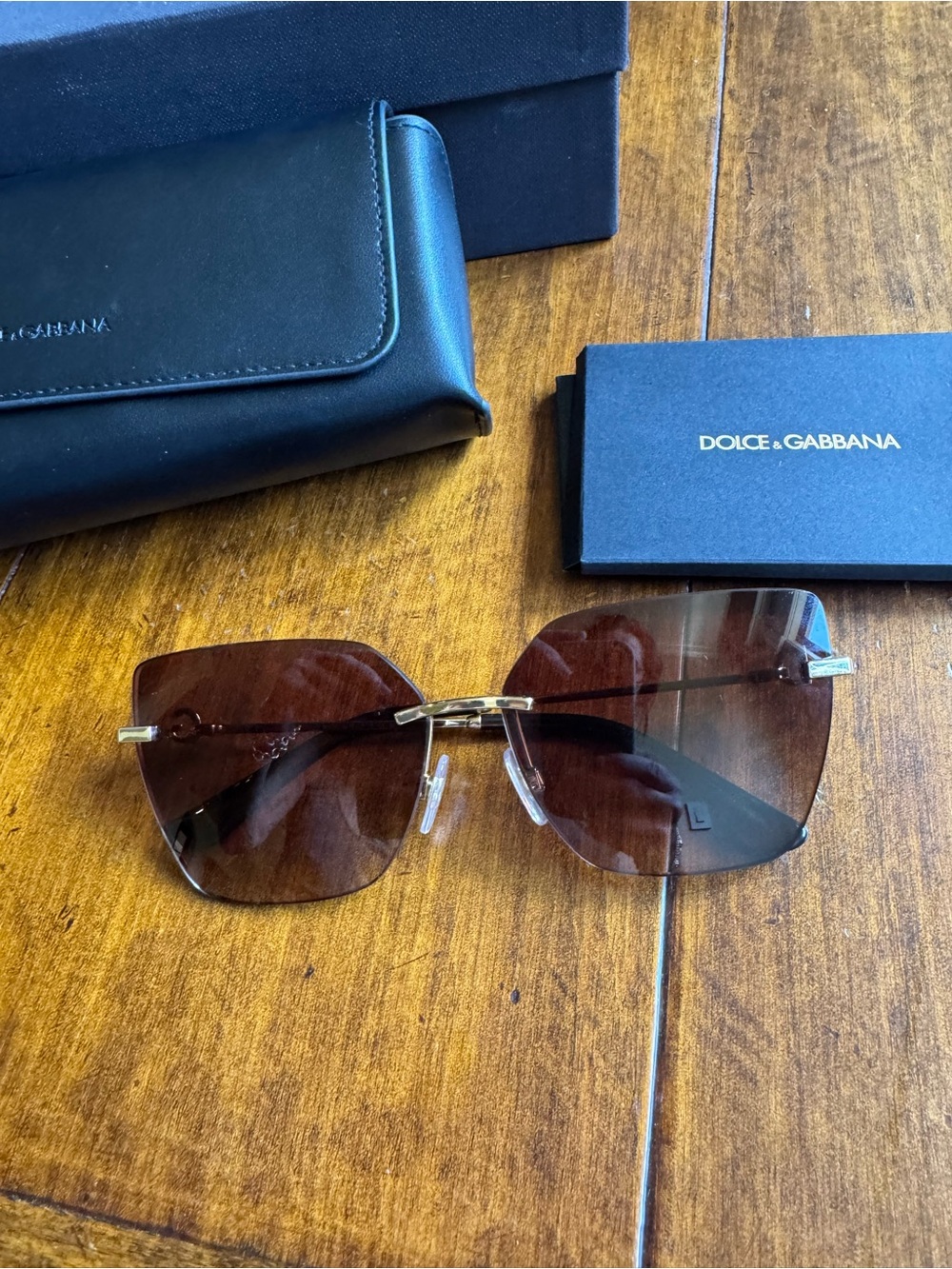 Dolce & Gabbana Rimless Sunglasses with Brown Gradient Lenses and Gold Accents
